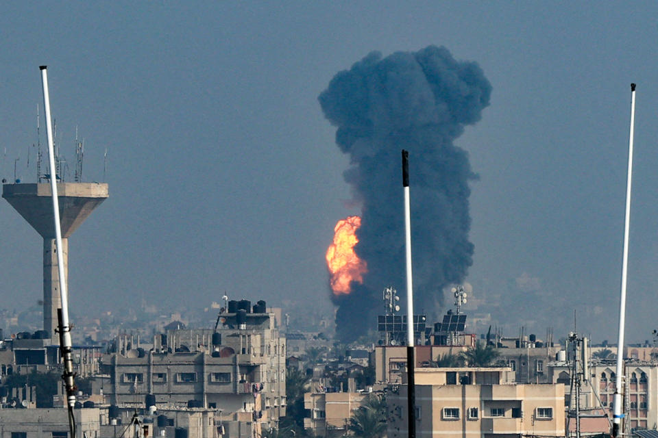 TOPSHOT - Smoke rises above buildings during an Israeli strike on Rafah in the southern Gaza Strip on December 1, 2023, after battles resumed between Israel and the Hamas movement. A temporary truce between Israel and Hamas expired on December 1, with the Israeli army saying combat operations had resumed, accusing Hamas of violating the operational pause. (Photo by SAID KHATIB / AFP) (Photo by SAID KHATIB/AFP via Getty Images)