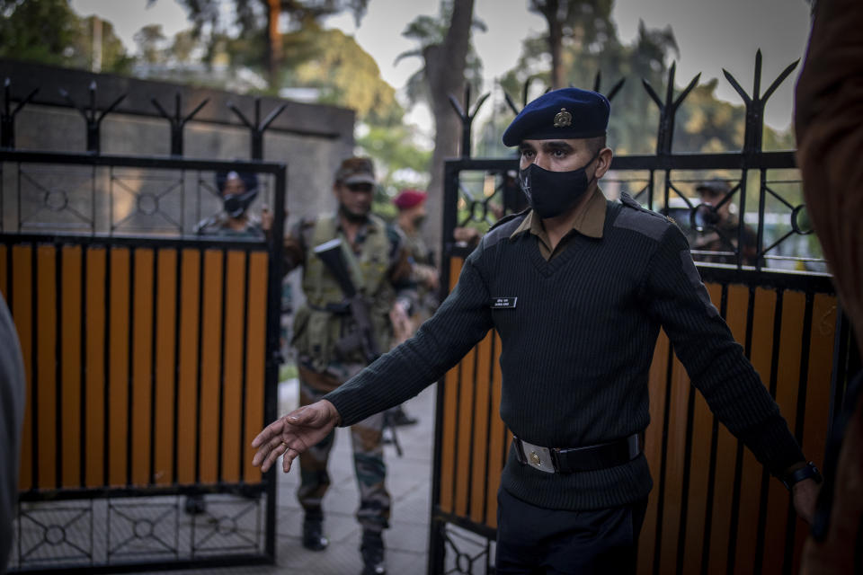 An Indian army soldier stands outside the residence of Chief of Defense Staff Bipin Rawat in New Delhi, India, Wednesday, Dec. 8, 2021. India’s military chief, Gen. Bipin Rawat, and 12 others were killed Wednesday in a helicopter crash in southern Tamil Nadu state, the air force said. (AP Photo/Altaf Qadri)