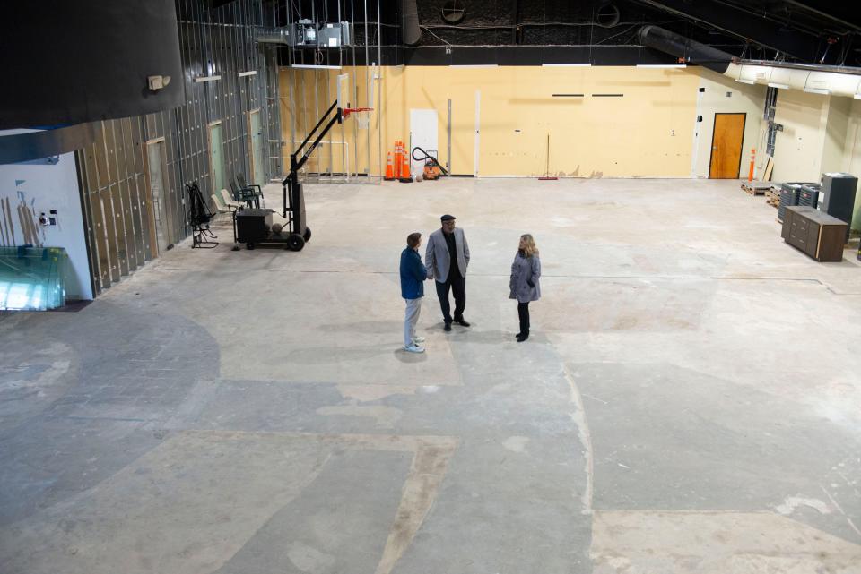 David Clark, Benny Washington and Lisa Bosarge talk Thursday about the future of the James B. Washington Education and Sports Inc. program during a tour of the organization's new building.