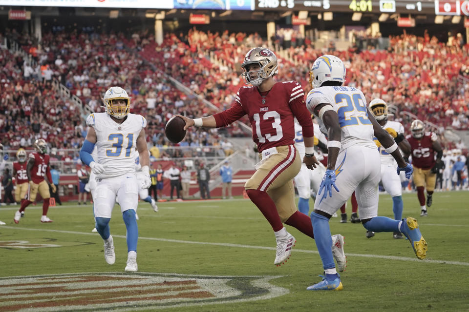 San Francisco 49ers quarterback Brock Purdy runs into the end zone for a touchdown during the first half of a preseason NFL football game against the Los Angeles Chargers Friday, Aug. 25, 2023, in Santa Clara, Calif. (AP Photo/Godofredo A. Vásquez)