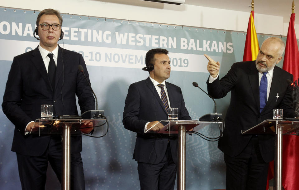 Albania's Prime Minister Edi Rama, right, talks for the media in presence of Serbia's President Aleksandar Vucic, left, and North Macedonia's Prime Minister Zoran Zaev, center, during a joint news conference, following the Western Balkan leaders' meeting in the southwestern town of Ohrid, North Macedonia, Sunday, Nov. 10, 2019. Western Balkan leaders say they are committed to work closely and to remove administrative barriers for free movement of goods and people between their countries. (AP Photo/Boris Grdanoski)