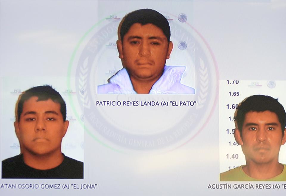 Pictures of the detainees for the case of missing students of Ayotzinapa are seen displayed on a television screen during a news conference at the Attorney General's Office building in Mexico City in this November 7, 2014, handout courtesy of the office. Mexico's government said on Friday evidence suggests that 43 missing trainee teachers were murdered and their charred remains tipped in a rubbish dump and a river in southwest Mexico, citing the confessions of three detained gang members. Attorney General Jesus Murillo said the detainees, caught a week ago, admitted setting fire to members of the group in a rubbish dump near Iguala in the state of Guerrero, where the students went missing on September 26 after clashing with police. REUTERS/Attorney General's Office/Handout via Reuters (MEXICO - Tags: CIVIL UNREST CRIME LAW POLITICS SOCIETY TPX IMAGES OF THE DAY) ATTENTION EDITORS - FOR EDITORIAL USE ONLY. NOT FOR SALE FOR MARKETING OR ADVERTISING CAMPAIGNS. THIS PICTURE WAS PROVIDED BY A THIRD PARTY. THIS PICTURE WAS PROCESSED BY REUTERS TO ENHANCE QUALITY