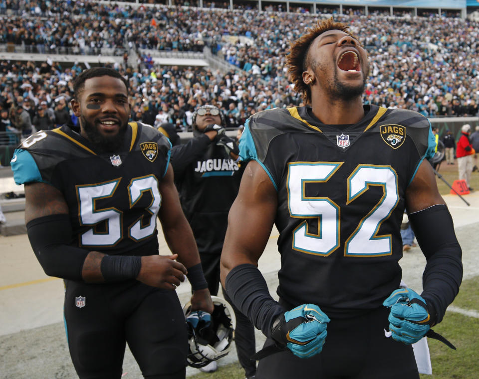 <p>Jacksonville Jaguars linebacker Donald Payne (52) and linebacker Blair Brown (53) celebrate after defeating the Buffalo Bills 10-3 in an NFL wild-card playoff football game, Sunday, Jan. 7, 2018, in Jacksonville, Fla. (AP Photo/Stephen B. Morton) </p>