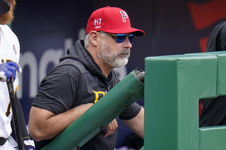 Pittsburgh Pirates manager Derek Shelton stands in the dugout during a baseball game against the Milwaukee Brewers in Pittsburgh, Sunday, July 4, 2021. (AP Photo/Gene J. Puskar)