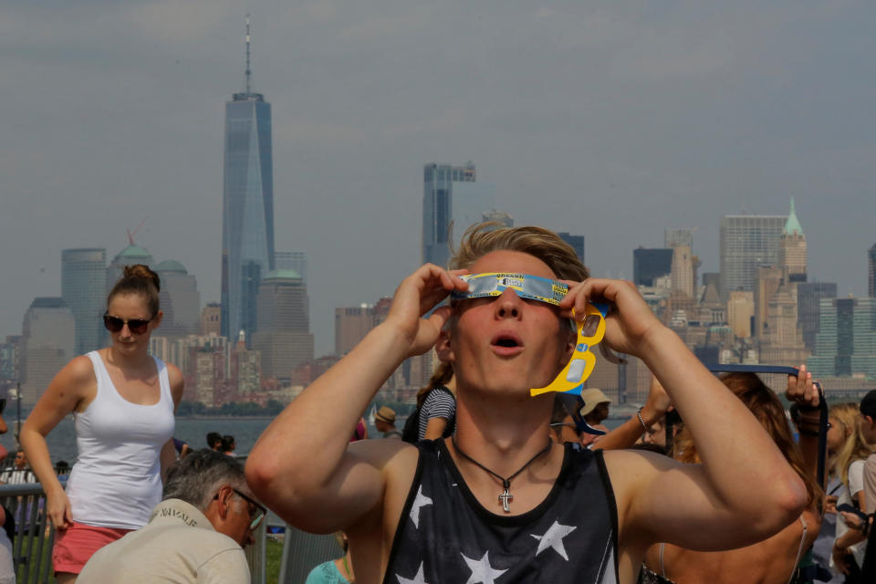 A man takes a look at the solar eclipse at Liberty State Island in New York.&nbsp;