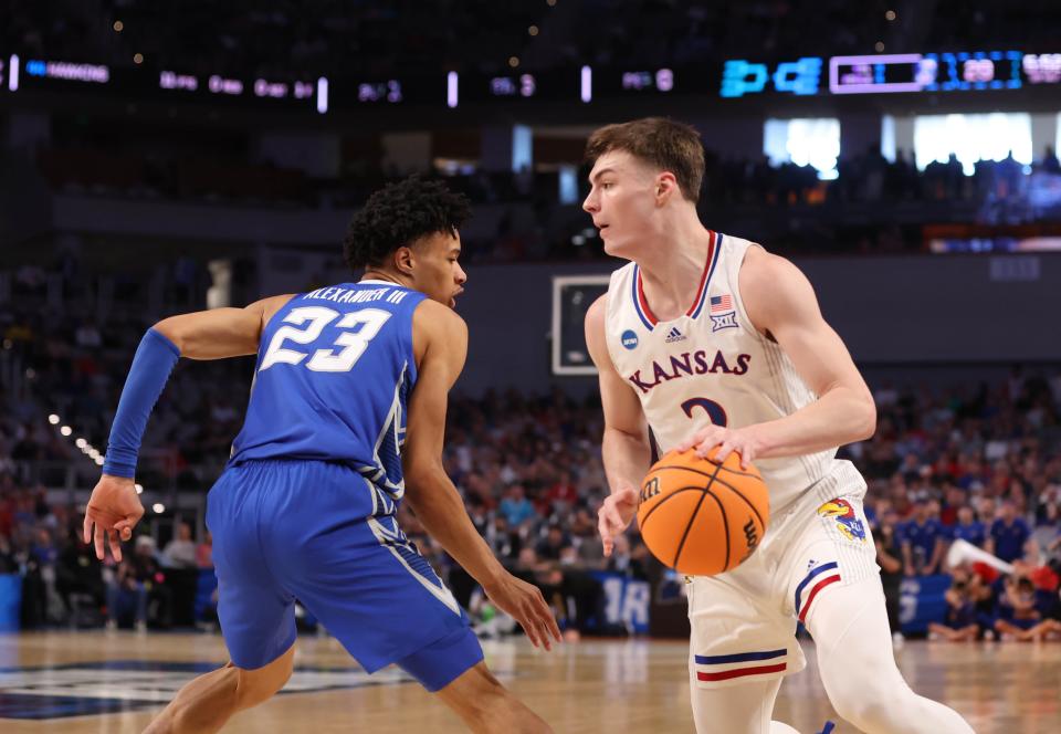 Kansas Jayhawks guard Christian Braun dribbles past Creighton Bluejays guard Trey Alexander during the second round of the 2022 NCAA Tournament at Dickies Arena. Braun was chosen in the first round of the NBA draft by the Denver Nuggets.