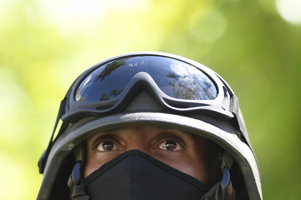 A soldier waits for a ceremony acknowledging the new members of the National Assembly in Caracas, Venezuela, Tuesday, Jan. 5, 2021. The ruling socialist party assumed the leadership of Venezuela's congress on Tuesday, the last institution in the country it didn't already control. (AP Photo/Matias Delacroix)