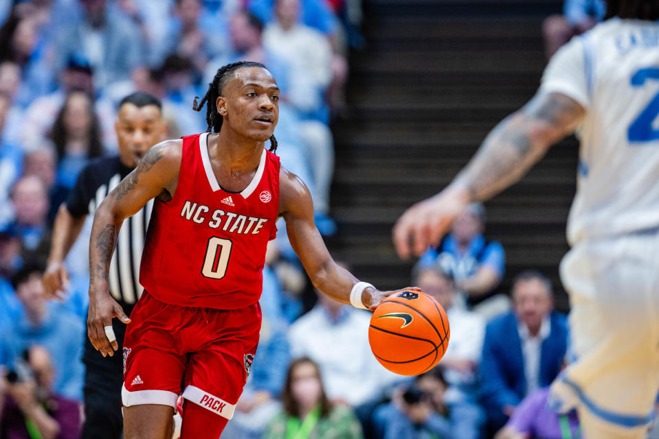 Mar 2, 2024; Chapel Hill, North Carolina, USA; North Carolina State Wolfpack guard DJ Horne (0) brings the ball up court against the North Carolina Tar Heels during the first half at Dean E. Smith Center. Scott Kinser-USA TODAY Sports