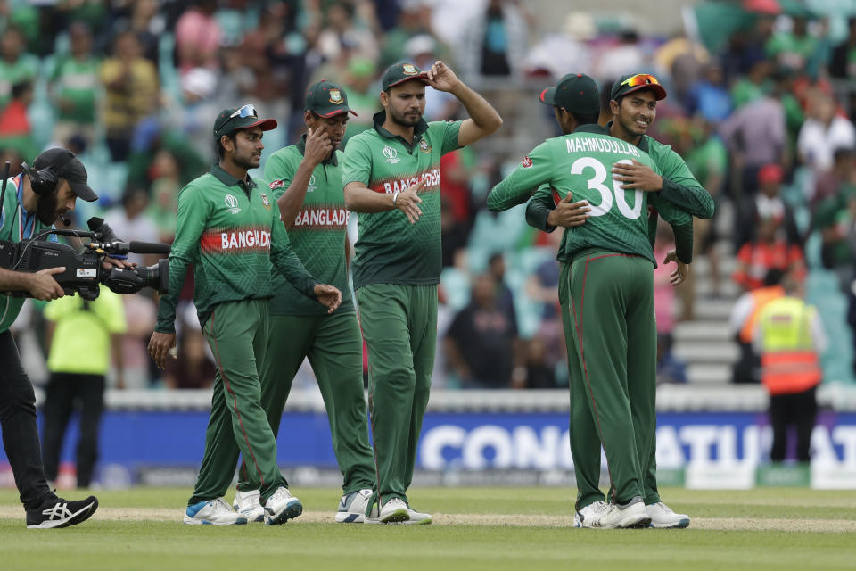 Bangladesh's captain Mashrafe Mortaza, centre, celebrates with his teammates as they walk off after winning by 21 runs in the Cricket World Cup match between South Africa and Bangladesh at the Oval in London, Sunday, June 2, 2019. (AP Photo/Matt Dunham)