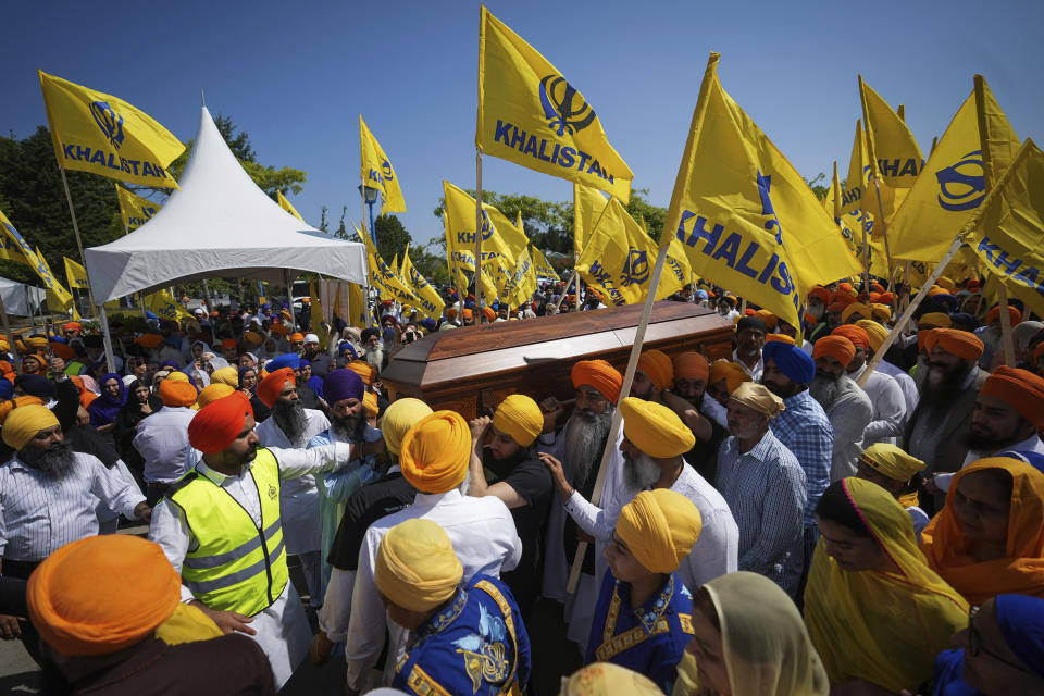 Mourners carry the casket of Sikh community leader and temple president Hardeep Singh Nijjar during Antim Darshan, the first part of a day-long funeral service for him, in Surrey, British Columbia, Sunday, June 25, 2023. Canada expelled a top Indian diplomat Monday, Sept. 18, as it investigates what Prime Minister Justin Trudeau called credible allegations that India’s government may have had links to the Sikh activist's assassination. (Darryl Dyck/The Canadian Press via AP)