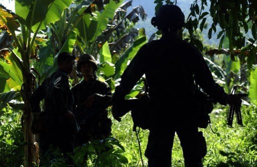 Philippine soldiers patrol the southern island of Jolo in 2007. The Philippines say they have killed three of Southeast Asia's most-wanted Islamic militants -- including a Malaysian bomb maker with a $5-million US government bounty on his head