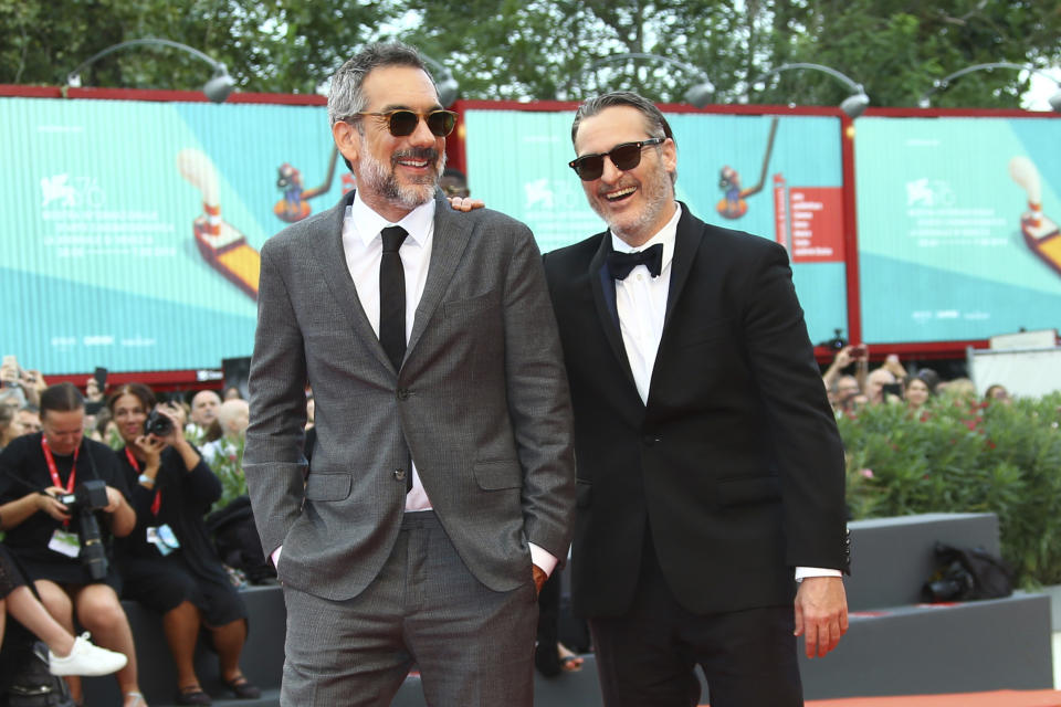 Actor Joaquin Phoenix, right, and Todd Phillips pose for photographers upon arrival at closing ceremony of the 76th edition of the Venice Film Festival, Venice, Italy, Saturday, Sept. 7, 2019. (Photo by Joel C Ryan/Invision/AP)