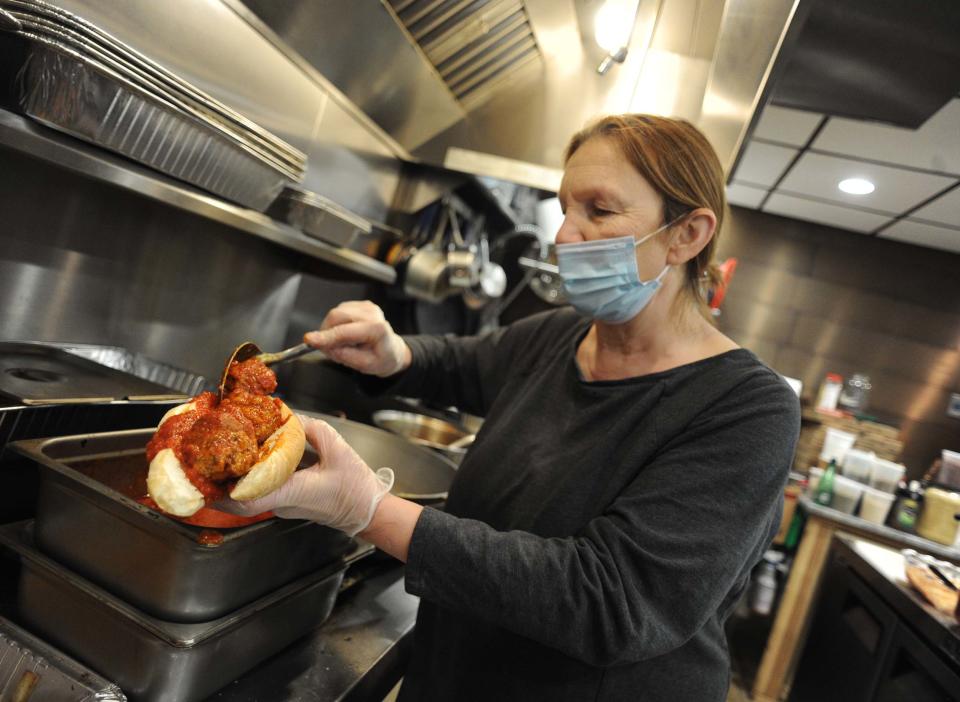 Rosa Galeno, owner of Rosa's Food Shoppe in Easton, makes her signature meatball sandwich on Wednesday, March 3, 2021.