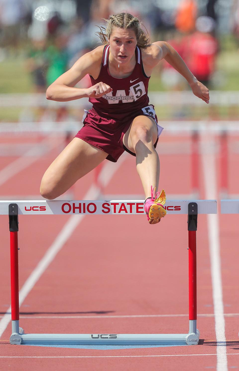 Woodridge's Anna Rorrer takes the last hurdle in the 300 meter hurdle semi-final race during the OHSAA Division II state track & field championships on Friday, June 2, 2023 in Columbus, Ohio, at Jesse Owens Memorial Stadium.