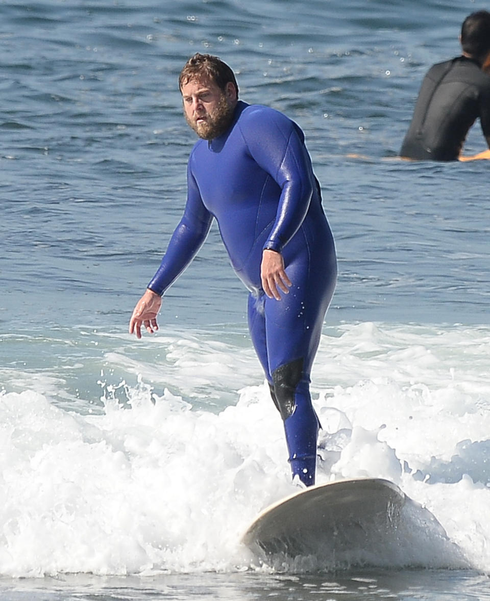 <p>Jonah Hill catches a wave on Monday in Malibu.</p>