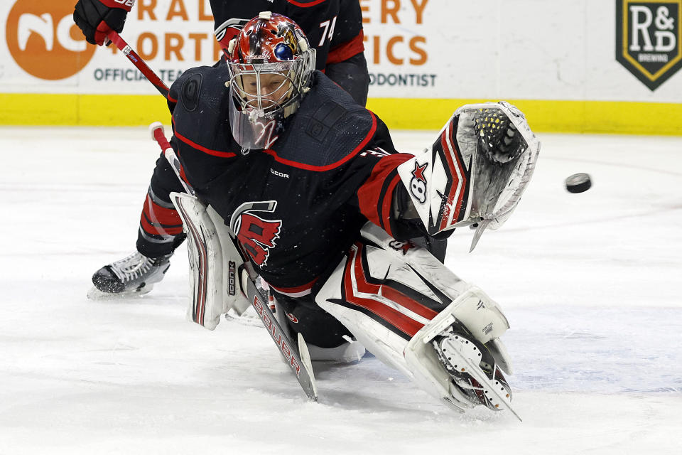 Carolina Hurricanes goaltender Antti Raanta (32) fails to stop a shot by Los Angeles Kings' Trevor Moore during the first period of an NHL hockey game in Raleigh, N.C., Monday, Jan. 15, 2024. (AP Photo/Karl B DeBlaker)