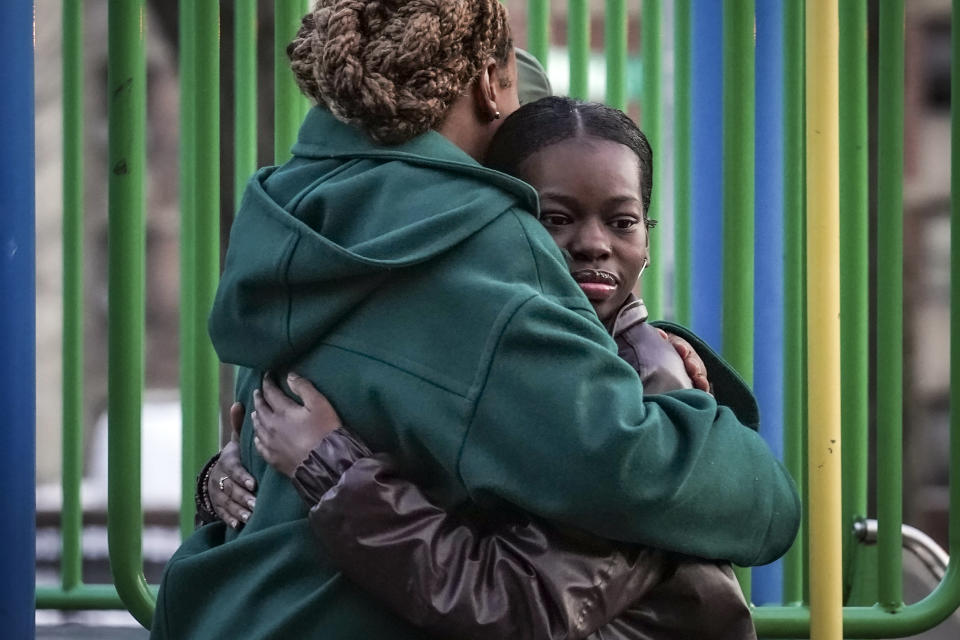 Derry Oliver, 17, right, hugs her mother, also Derry Oliver, during a visit to a playground near home, Friday, Feb. 9, 2024, in New York. During the COVID-19 pandemic, the younger Oliver embraced therapy as she struggled with the isolation of remote learning, even as her mother pushed back. (AP Photo/Bebeto Matthews)