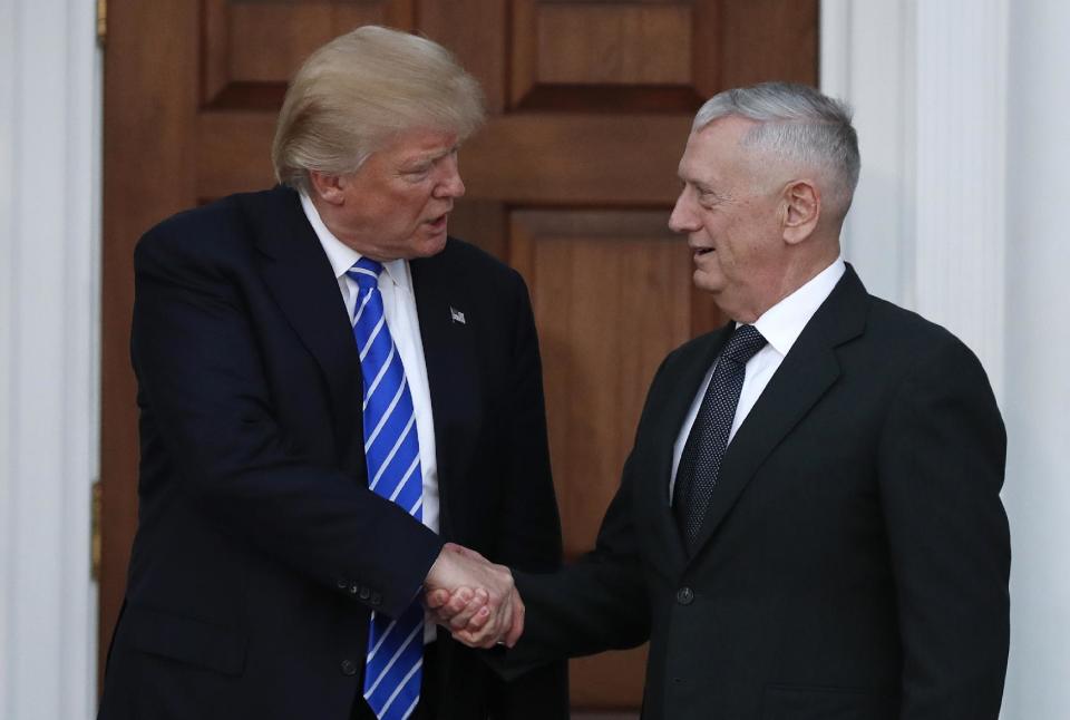 FILE - In this Nov. 19, 2016, file photo, President-elect Donald Trump shakes hands with retired Marine Gen. James Mattis as he leaves Trump National Golf Club Bedminster clubhouse in Bedminster, N.J. Mattis is an outspoken critic of Iran, calling it the biggest threat to stability in the Mideast. (AP Photo/Carolyn Kaster, File)