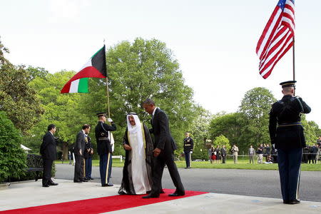 U.S. President Barack Obama (C right) walks with Kuwaiti Crown Prince Nawaf Al-Ahmad Al-Jaber Al-Sabah (C left) as he plays host to leaders and delegations from the Gulf Cooperation Council countries at the White House in Washington May 13, 2015. REUTERS/Jonathan Ernst