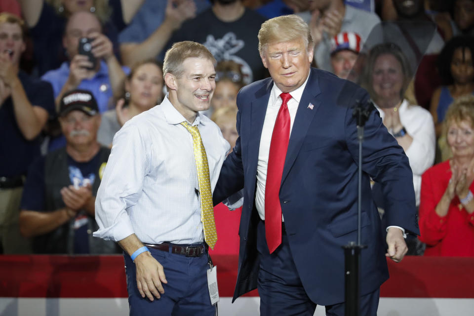 FILE - Then-President Donald Trump, right, encourages Rep. Jim Jordan, R-Ohio, left, to speak during a rally, Saturday, Aug. 4, 2018, in Lewis Center, Ohio. (AP Photo/John Minchillo, File)