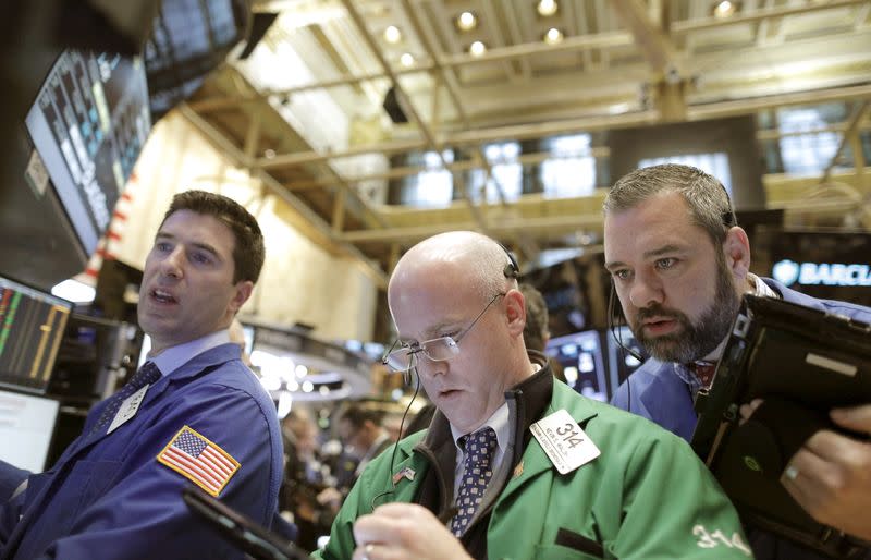 Traders work on the main trading floor of the New York Stock Exchange shortly after the opening bell of the trading session in New York