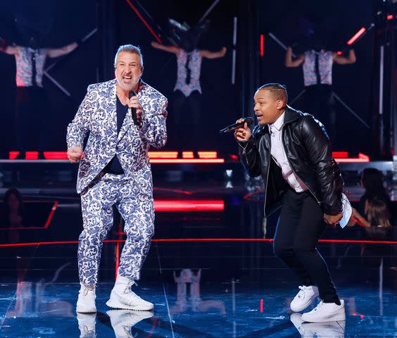 <p>Trae Patton / FOX</p> Joey Fatone (left) and Bow Wow perform on 'The Masked Singer' season 10.