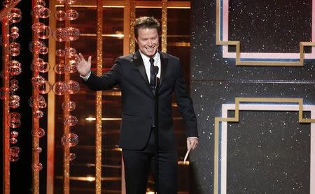 Billy Bush presents the award for outstanding supporting actor in a drama series during the 41st Annual Daytime Emmy Awards in Beverly Hills, California June 22, 2014. REUTERS/Danny Moloshok