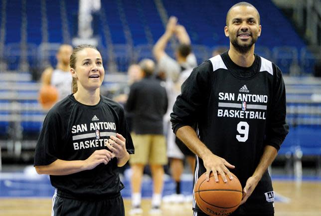 Becky Hammon (l), pictured with Tony Parker, was appointed to the San Antonio Spurs’ coaching staff in the summer.