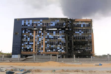 A damaged building is pictured after clashes between rival militias, in an area at Alswani road in Tripoli July 28, 2014. REUTERS/Hani Amara