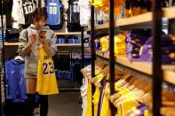 A customer shops in the NBA Store in New York