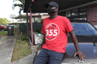 James Jackson poses for a photograph outside his home during the coronavirus pandemic, Thursday, July 30, 2020, in West Park, Fla. Jackson is among the tens of thousands hospitality workers fighting for survival in the age of the pandemic. Jackson's employer, the Diplomat Beach Resort, in Hollywood, Fla., was forced to close in March because of the outbreak. (AP Photo/Lynne Sladky)