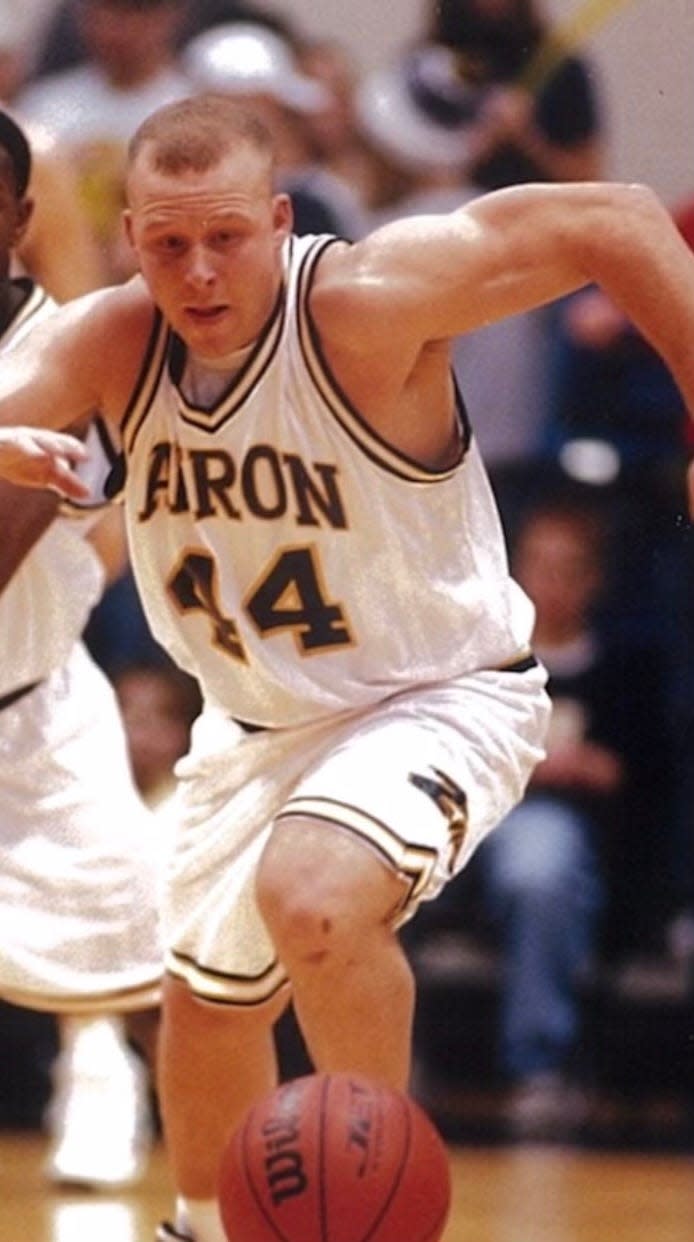 Jami Bosley chases a loose ball while playing for the University of Akron