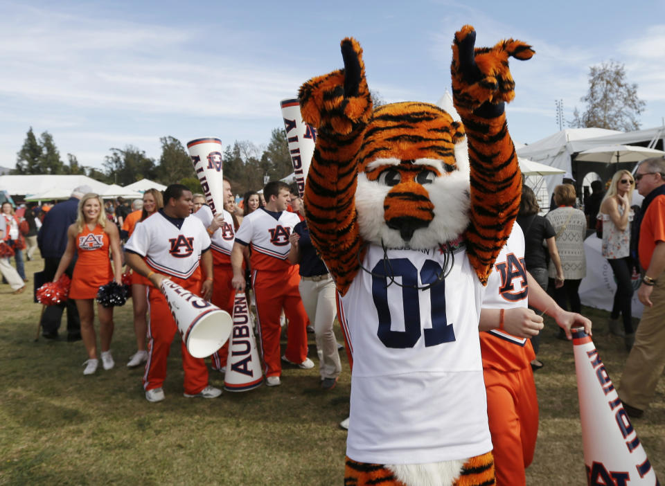 Auburn mascot "Aubie" greets fans as they arrive before the NCAA BCS National Championship college football game between Florida State and Auburn Monday, Jan. 6, 2014, in Pasadena, Calif. (AP Photo/Gregory Bull)