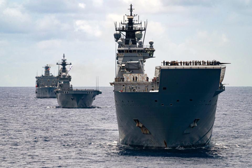 Three Australian warships in formation in the sea