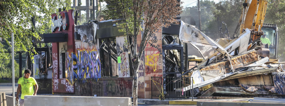 The Wendy's where Rayshard Brooks was killed by Atlanta police last month is torn down on Tuesday, July 14, 2020. Construction crews used an excavator to demolish the charred remains of the University Avenue restaurant. It is not clear who ordered Tuesday's demolition, which comes a little more than a week after demonstrators who had camped out at the site following Brooks' death were forced off the property. The Wendy's became ground zero for protests after Brooks was shot in the parking lot following an attempted DUI arrest in the drive-thru line June 12.