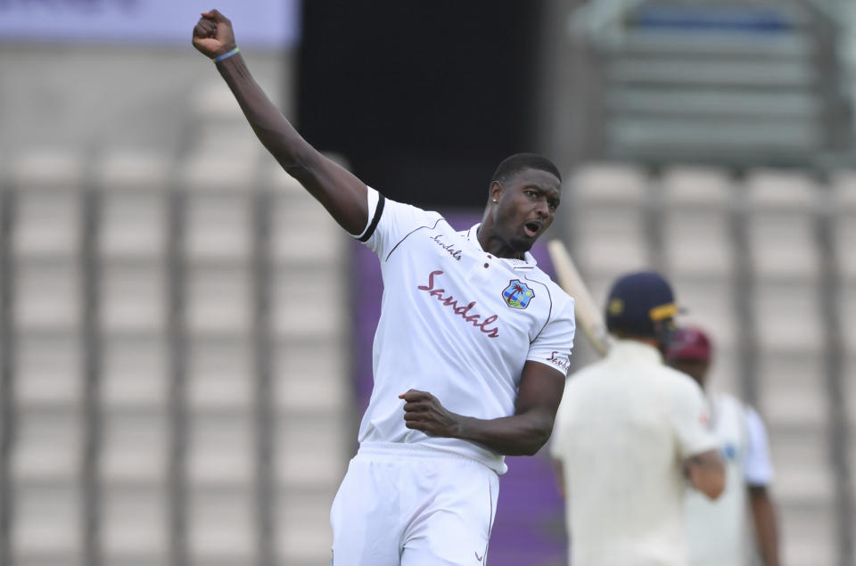 West Indies' captain Jason Holder celebrates the dismissal of England's Ollie Pope during the second day of the first cricket Test match between England and West Indies, at the Ageas Bowl in Southampton, England, Thursday, July 9, 2020. (Mike Hewitt/Pool via AP)