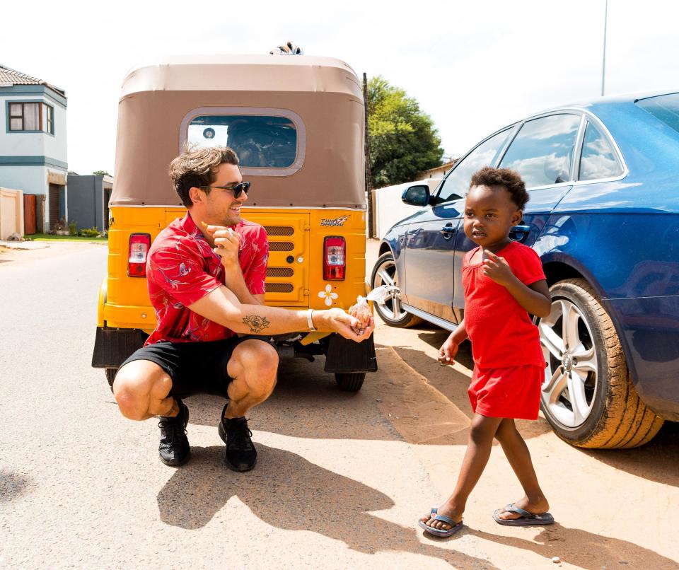 <p>Matty J flaunts his clucky side as he spent time with the local kids in Soweto.</p>