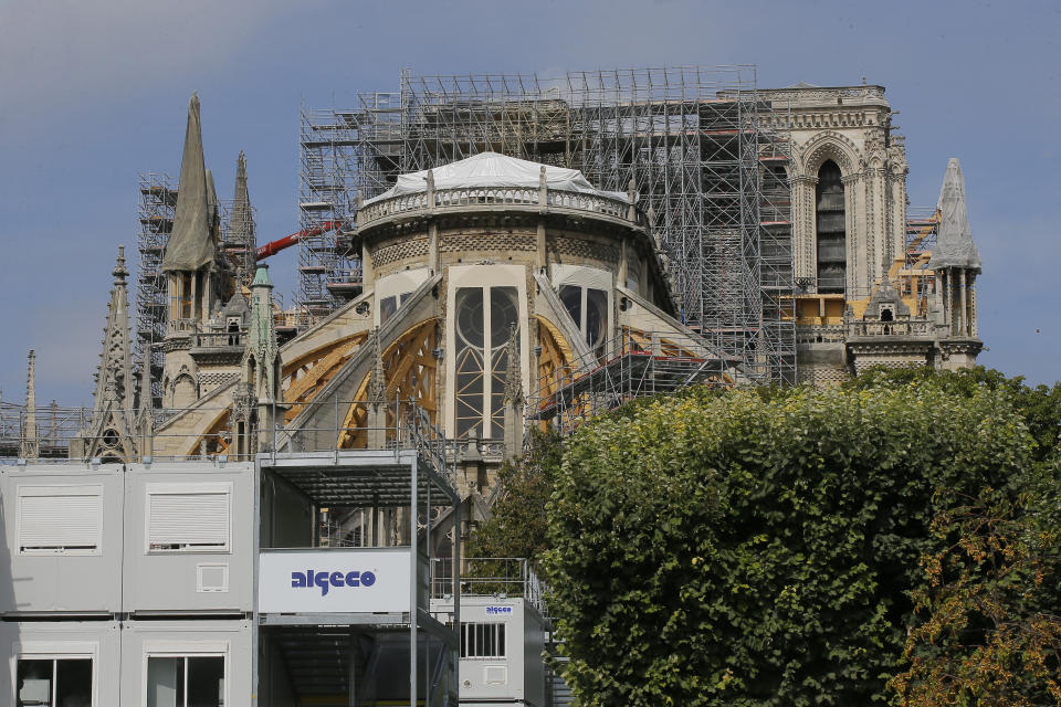 Scaffolding platforms are set up at Notre Dame Cathedral, in Paris, Thursday, Aug. 1, 2019, as the preliminary work begins to repair the fire damage. (AP Photo/Michel Euler)