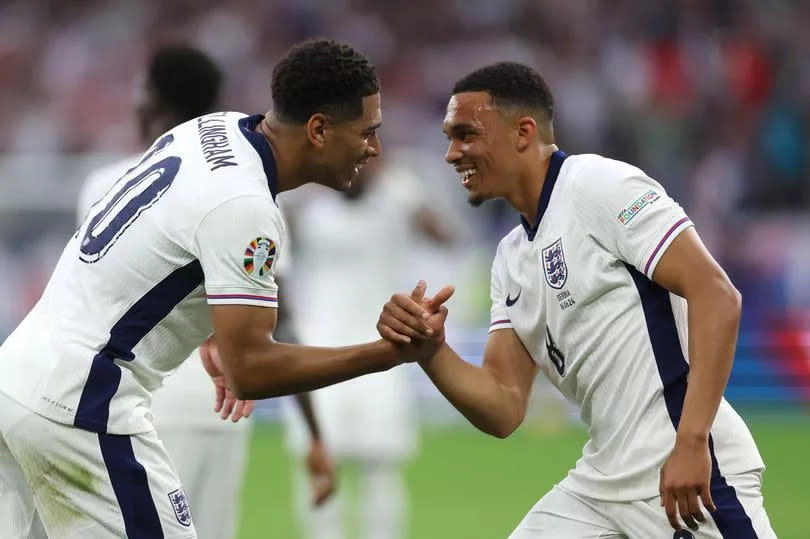 Jude Bellingham and Trent Alexander-Arnold celebrate Bellingham's goal against Serbia at Euro 2024.