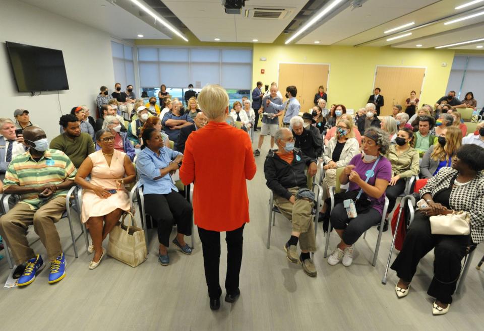 U.S. Sen. Elizabeth Warren, center, listens to questions from South Shore residents about various concerns during a meet and greet at the Randolph Intergenerational Community Center in Randolph, Monday, June 27, 2022.