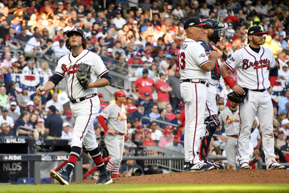 Atlanta Braves pitcher Luke Jackson, left, is relieved with bases loaded in the third inning of Game 5 of their National League Division Series baseball game against the St. Louis Cardinals, Wednesday, Oct. 9, 2019, in Atlanta. (AP Photo/John Amis)