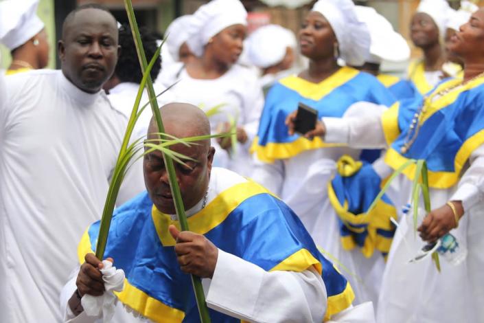 Members of the Celestial Church of Christ International headquarters observe a procession on Palm Sunday, in Lagos, Nigeria, 10 April 2022