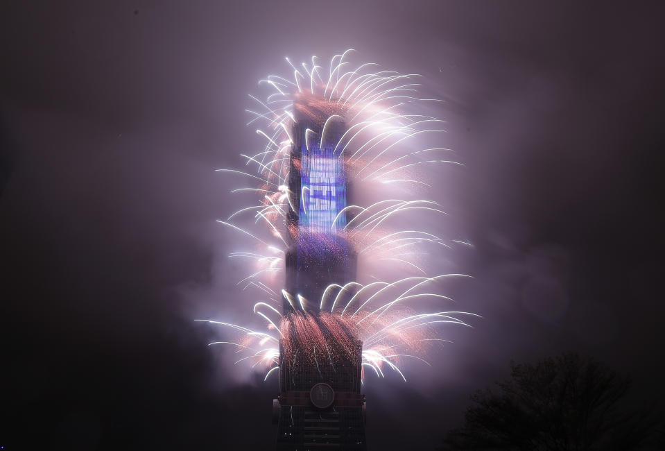 A firework display explodes off Taiwan's tallest skyscraper Taipei101 to usher in the New Year in Taipei, Taiwan, Sunday, Jan. 1, 2023. (AP Photo/Chiang Ying-ying)