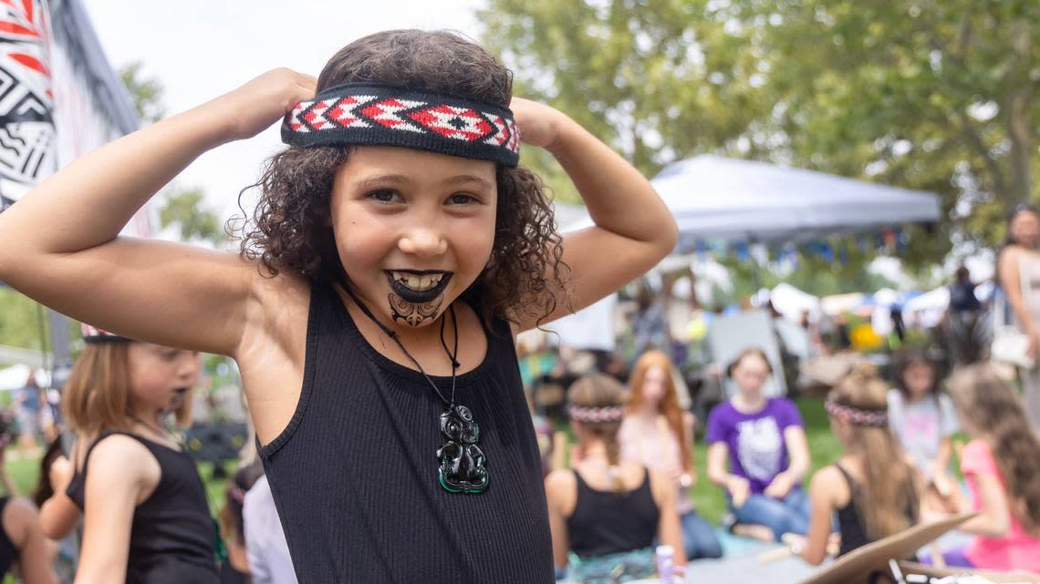 Amaya Arupp, 7, puts on Māori attire at the Idaho Island Festival at Kleiner Park in Meridian, Saturday, August. 3, 2024.