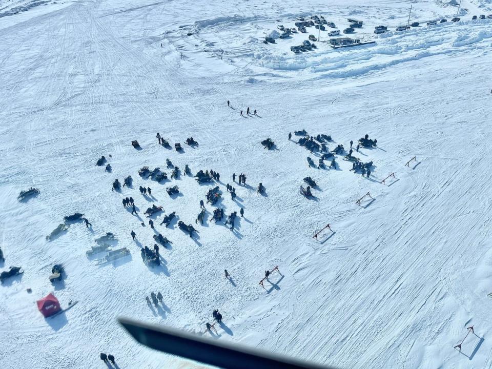 Racers in the annual Rankin Inlet to Whale Cove, Nunavut race, seen from the view of a helicopter. 