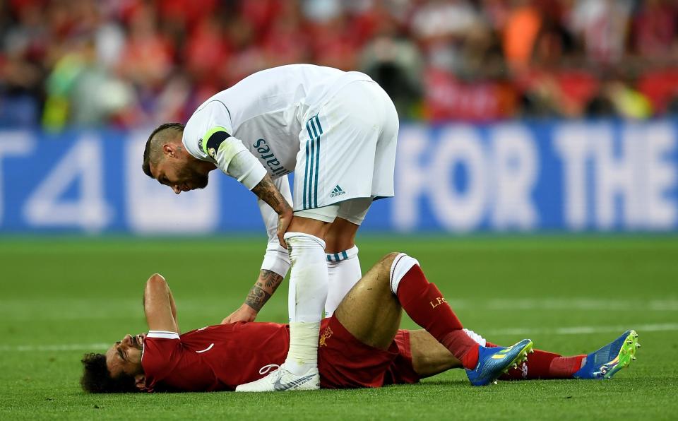 <p>Mo Salah lies on the ground in agony after his left shoulder popped out for a second time </p>