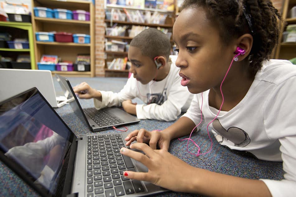  Kids using broadband in school. 