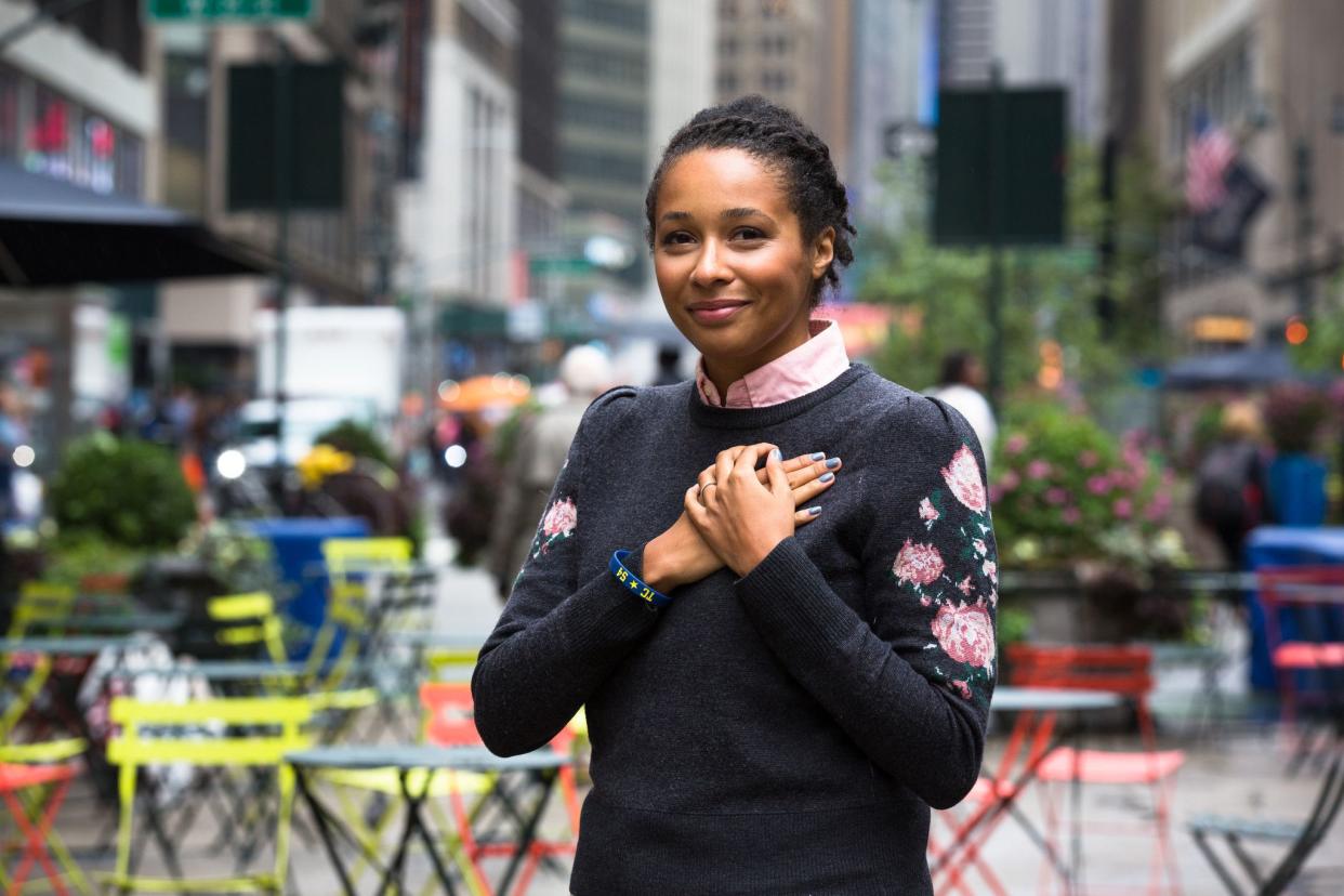 Karen Hill in Manhattan in 2018. Hill wears a bracelet engraved with heart donor Thomas Cutinella's initials that was given to her from the Cutinella family. 
