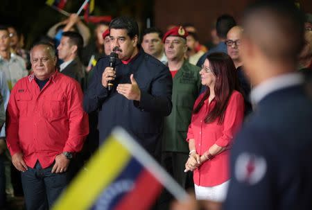 Venezuela's President Nicolas Maduro (C) speaks during a meeting with government members after the announcement of the results of the nationwide election for new governors in Caracas, Venezuela October 15, 2017. Miraflores Palace/Handout via REUTERS