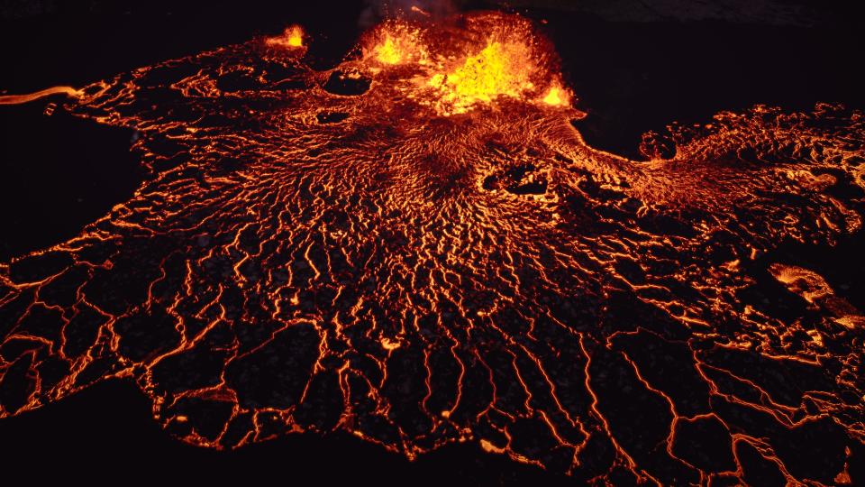 lava flowing from a central source on a black background